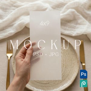 May include: A mockup card held by a hand, with the text "4x9" and "MOCKUP PSD + JPG". The card is placed on a plate with a gold fork and knife. The background includes a white cloth.