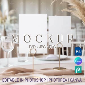 May include: A mockup image featuring two blank white cards held by gold metal stands. The word "MOCKUP" is displayed in a brown font. Text on the image includes "PSD + JPG + PNG" and "EDITABLE IN PHOTOSHOP | PHOTOPEA | CANVA".
