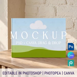 May include: A landscape-oriented book mockup featuring a light blue sky with a single white cloud above rolling green hills. The cover displays the text MOCKUP PSD + CANVA DRAG & DROP. Icons for Photoshop, Canva, and Photopea are visible on the right.