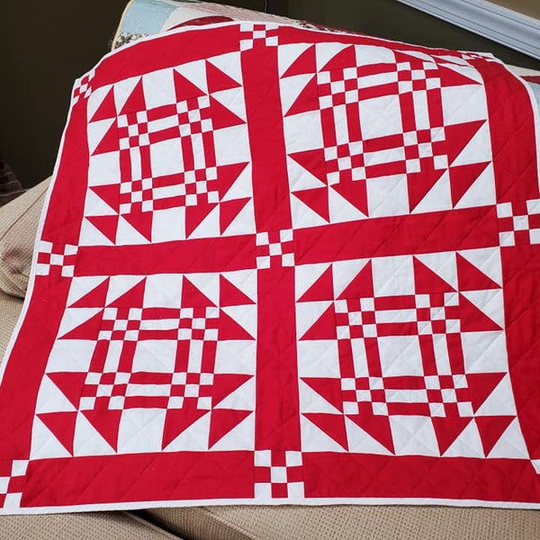 Homemade red and white lap quilt