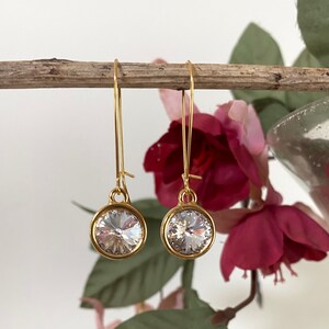 Boucles doreilles Swarovski Long Dangling. Deux finitions, plusieurs couleurs Gold/clear