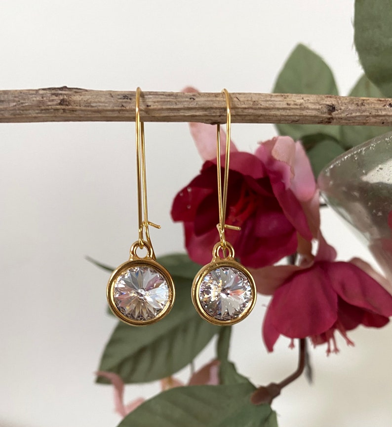 Boucles doreilles Swarovski Long Dangling. Deux finitions, plusieurs couleurs Gold/clear