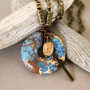 Blue Magnesite Donut Necklace: Antiqued Brass Cross, Leather Cord