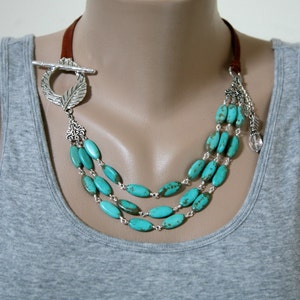 Turquoise Magnesite Necklace: Three Strand Leather Cord, Antiqued Silver Leaf Clasp