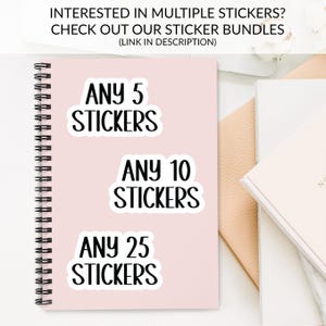 The image is an advertisement for a sticker bundle, featuring a pink notebook with the text "ANY 5 STICKERS ANY 10 STICKERS ANY 25 STICKERS" and a white notebook with the text "ANY 5 STICKERS ANY 10 STICKERS ANY 25 STICKERS".