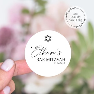 May include: White round sticker with a black Star of David, the text "Ethan's Bar Mitzvah" and the date "11.16.2025".
