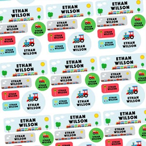 May include: A sheet of personalised name labels featuring the name "Ethan Wilson." The labels have various designs, including trains, suns, trees, and railroad crossing signs. The labels are in rectangular and circular shapes.