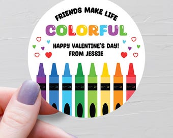 May include: A round Valentine's Day sticker with the text "Friends make life colorful. Happy Valentine's Day! From Jessie." and a rainbow of crayons.