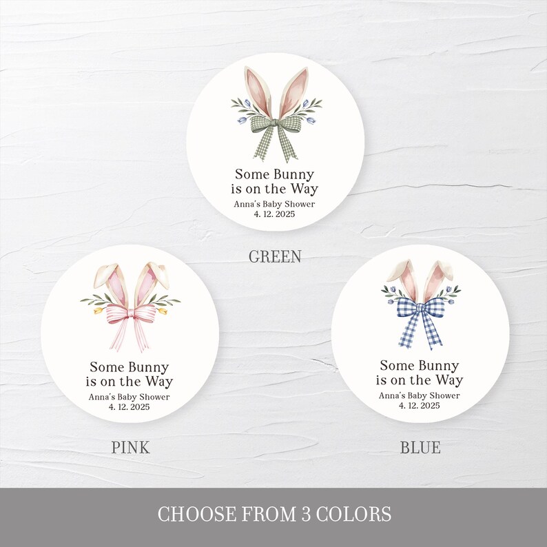 May include: Three round stickers with a bunny rabbit illustration and the text "Some Bunny is on the Way" with a choice of green, pink, or blue bows. The text also includes "Anna's Baby Shower" and the date "4. 12. 2025".