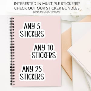 The image is an advertisement for a sticker bundle, featuring a pink notebook with the text "ANY 5 STICKERS ANY 10 STICKERS ANY 25 STICKERS" and a white notebook with the text "ANY 5 STICKERS ANY 10 STICKERS ANY 25 STICKERS".
