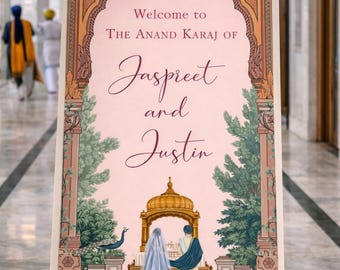 May include: A wooden easel displays a sign with the words "Welcome to The Anand Karaj of Jaspreet and Justin." The sign features an ornate design with a pink background and illustrations of a peacock and a couple under a golden dome.