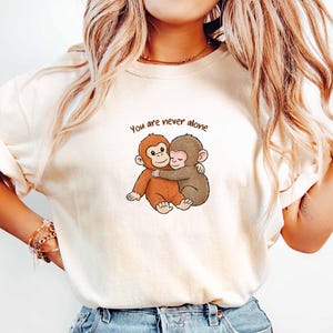 ComfortColors® Baby Punch Monkey Shirt, You Are Never Alone Shirt, Viral Hugging Monkeys T-Shirt