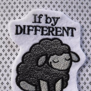 May include: White felt patch with black embroidery. The patch features a black sheep with the text "If by DIFFERENT you mean AWESOME".