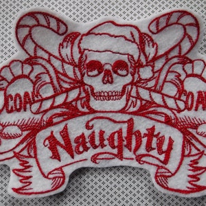 May include: Red embroidered Christmas patch with a skull wearing a Santa hat and the words "Naughty" and "Coal" on either side.