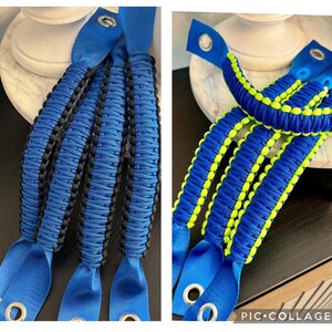 May include: Two sets of blue and black paracord door handles. The handles are braided with a black and blue pattern. The handles have a blue loop at the end with a metal grommet.