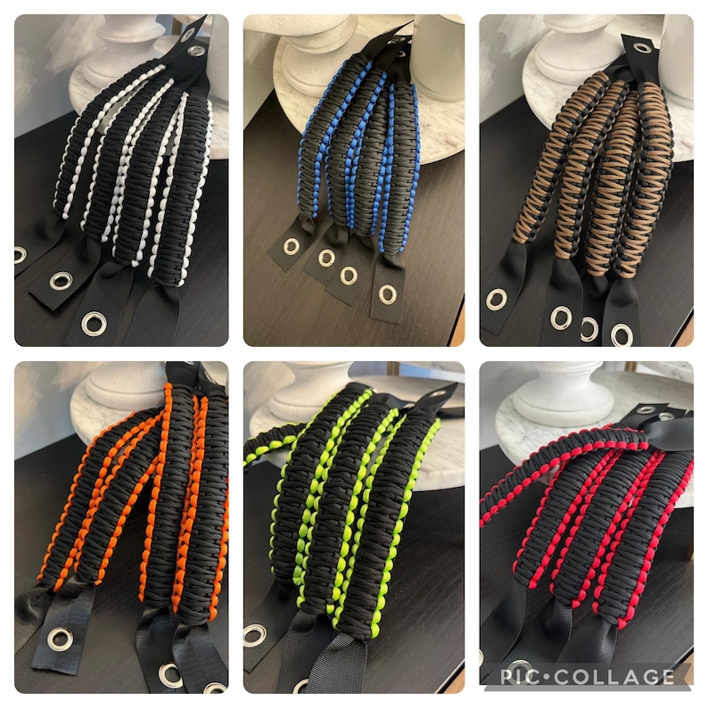 May include: Set of six paracord door handles with black webbing and different colored stripes. The handles have metal grommets and are ready to be attached to a door.