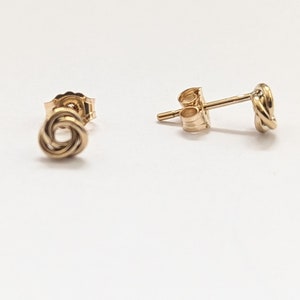 Tiny gold stud earrings. 14k gold filled earrings, dainty 5mm knot studs & butterfly backs.  Gold jewellery gift for her