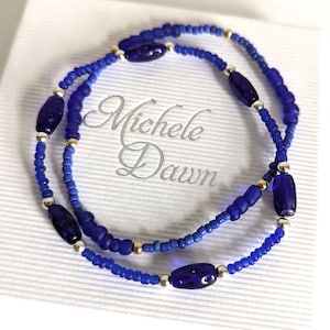 Set of two blue stretch bracelets. Shades of navy and bright royal blue glass and seed beads. One size stretch stacking bracelets. Hoc Sp.Wi