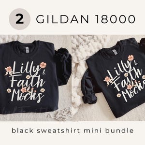 May include: Two black sweatshirts with the text "Lilly & Faith Mocks" in white, adorned with floral accents. The sweatshirts are part of a mini bundle, as indicated by the text at the bottom. The brand is Gildan 18000.