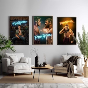 May include: Three framed posters for the film "Road House." The posters display actors in action poses, with neon-style text. The first poster shows a man in a tropical setting. The second poster shows two men facing each other. The third poster shows a man with tattoos.