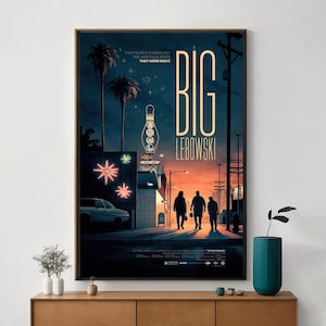 May include: A framed poster for the film "The Big Lebowski", with a vintage design. The poster features a bowling pin, palm trees, and the film's title in large, bold letters. The colour scheme includes blues, oranges, and yellows, creating a retro feel.