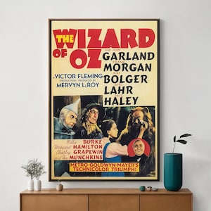 May include: A vintage movie poster for the 1939 film "The Wizard of Oz" featuring Judy Garland, Frank Morgan, Ray Bolger, Bert Lahr, and Jack Haley. The poster is in color and features a scene from the film with the characters Dorothy, the Scarecrow, the Tin Man, the Cowardly Lion, and the Wicked Witch of the West. The poster also includes the film's title, the names of the actors, and the tagline "Metro-Goldwyn-Mayer's Technicolor Triumph!"