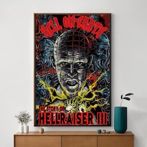 May include: A poster for the horror film Hellraiser III: Hell on Earth. The poster features a close-up of the character Pinhead, a demonic figure with a grid-like head and numerous hooks. The text "The Story of Hellraiser III" is displayed at the bottom of the poster.