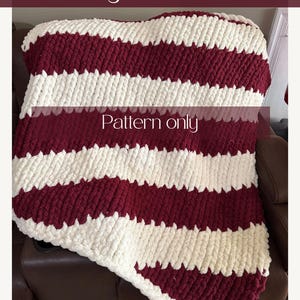 May include: A chunky knit blanket featuring horizontal stripes in cream and deep red. The text "Make your own Chunky Knit Blanket", "Pattern only", and "Digital Download" is overlaid on the image of the textured, thick-yarn textile.