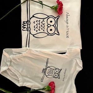 May include: Two white t-shirts with a black owl graphic and the text "Always a Hoot".