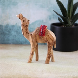 Two Olive Wood Camel Statue Hand Carved in Holy Land Figurine Red Saddle. Hand Made in Holy Land Jerusalem, 8x11 centimeters