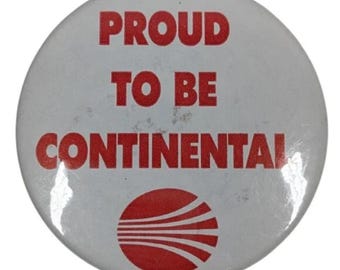 Botón vintage de Continental Airlines con el logo rojo "Orgulloso de ser Continental"