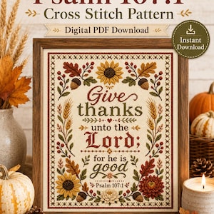 Puede incluir: Un patrón de punto de cruz enmarcado con el texto Psalm 107:1, Give thanks unto the Lord; for he is good. El diseño incluye girasoles, hojas de otoño, bellotas y tallos de trigo bordados en tonos naranja, amarillo, rojo y verde sobre tela.
