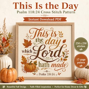 May include: A cross stitch pattern titled This Is the Day Psalm 118:24 featuring brown and orange text surrounded by autumn leaves and a pumpkin. The design includes the phrase This is the day which the Lord hath made and 250 x 250 stitches.