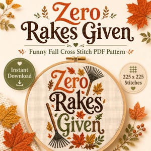 May include: A cross stitch pattern in a wooden hoop featuring the text Zero Rakes Given in orange, brown, and green, surrounded by stitched autumn leaves and two garden rakes. The design includes text indicating an instant download and 225 x 225 stitches.