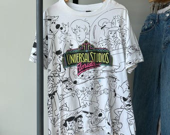 VINTAGE 90s | Universal Studios Florida All Over Print Cartoons T-Shirt sz M