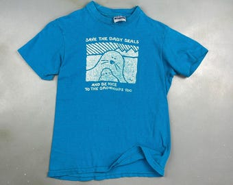 VINTAGE 90s | Save The Baby Seals Blue T-Shirt sz XS Men Adult