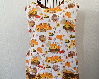 Pumpkins and turkeys, Fall motif women's apron, cobbler style , closes in back at the neck with ties, cooking, cleaning, crafting, linens,