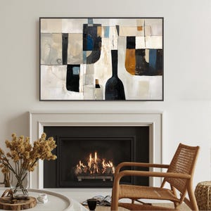 May include: Abstract art print featuring a black framed painting with a wine bottle theme. The artwork uses a palette of black, white, beige, and blue. The painting hangs above a fireplace with a burning fire, a wooden chair, and a vase of dried flowers.