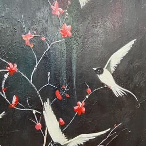 May include: A painting of three white birds flying in front of a black background with red flowers and branches.