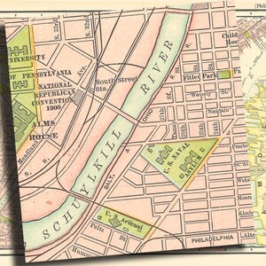 May include: A vintage map of Philadelphia, Pennsylvania, showing the Schuylkill River, the city's streets, and landmarks like the U.S. Naval Asylum and the National Republican Convention of 1900.