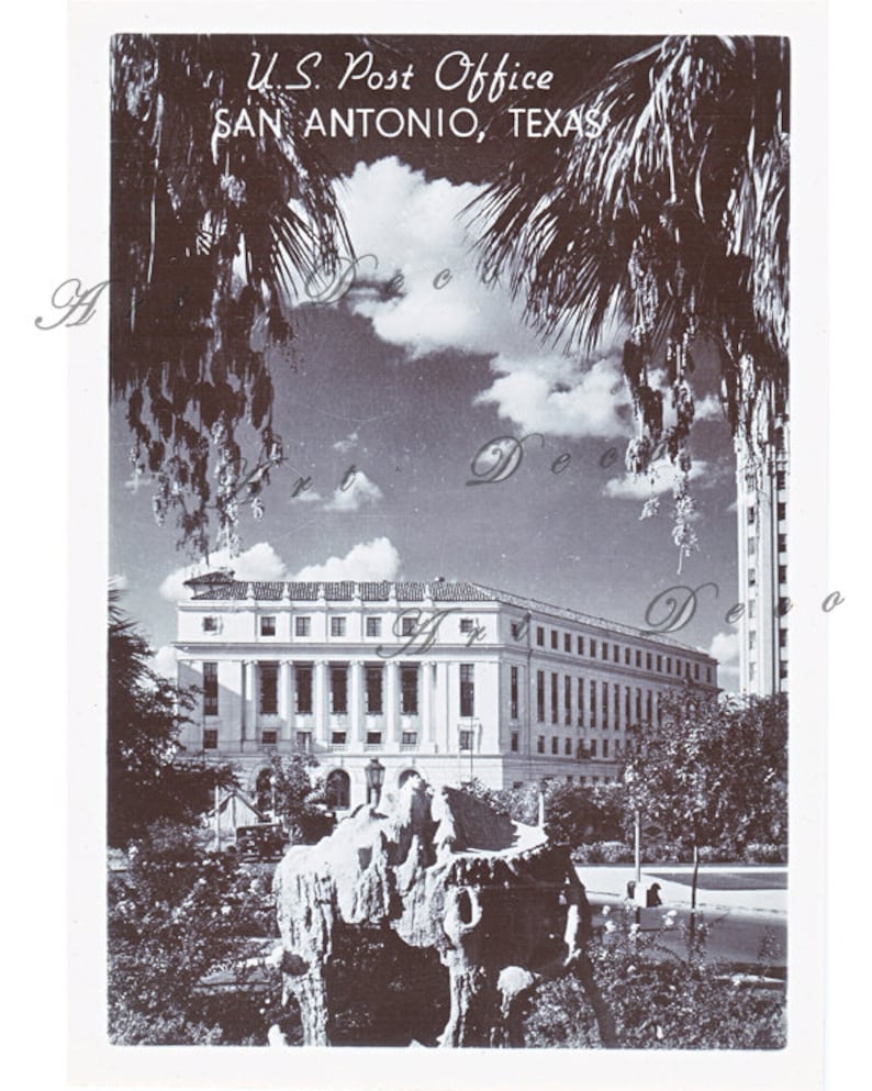 May include: A black and white vintage postcard showing a photograph of the U.S. Post Office in San Antonio, Texas. The building is a large, classical structure with a prominent entrance and many windows. Palm trees are visible in the foreground and background.