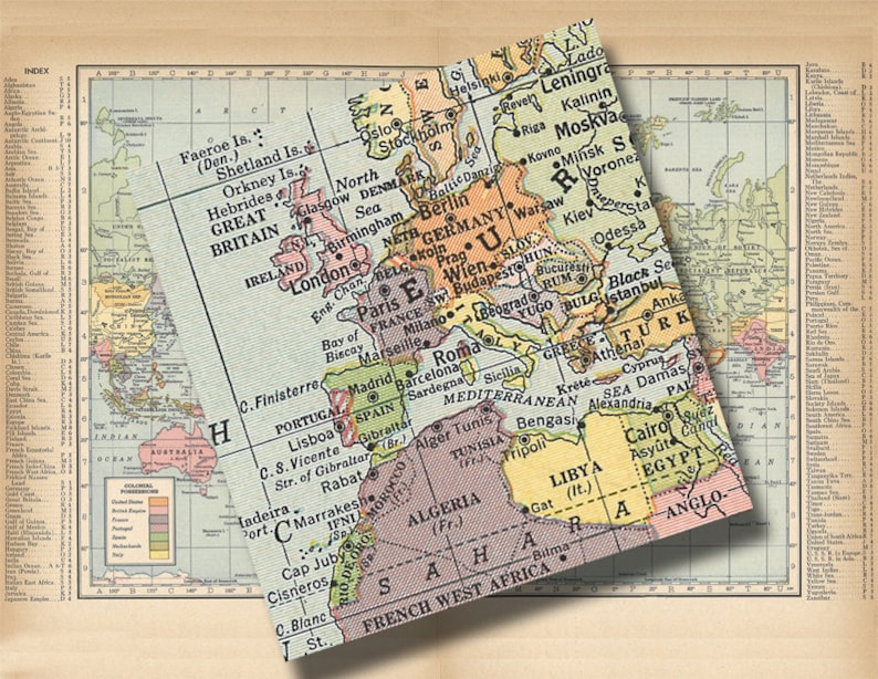 May include: A vintage world map with a focus on Europe, the Middle East, and Africa. The map is printed on paper with a light brown background and features a variety of colors to represent different countries and regions. The map includes text labels for major cities, countries, and geographical features.