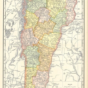 May include: A vintage map of Vermont, USA, showing the state's counties and major cities. The map is printed in a light brown color with county borders in yellow, orange, and green. The map includes a scale and a legend.