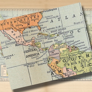 May include: A vintage map of North and South America, with a focus on Central and South America. The map is printed on a light blue background with brown and green borders. The map includes the names of countries, cities, and geographic features.