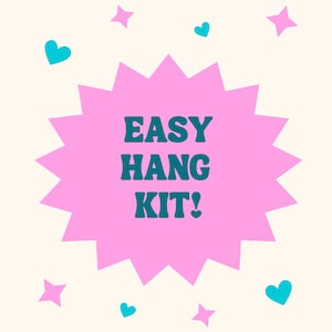 May include: A pink burst shape with the words "EASY HANG KIT!" in teal. The background is cream-colored with teal hearts and pink stars scattered around the burst.