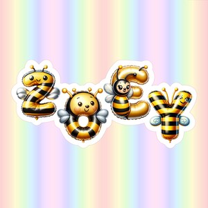 May include: A sticker set spelling "ZOY" with bee-themed designs. The letters are stylized as yellow and black striped balloons, each with a smiling bee face and wings. The background is a soft gradient of pastel colors.