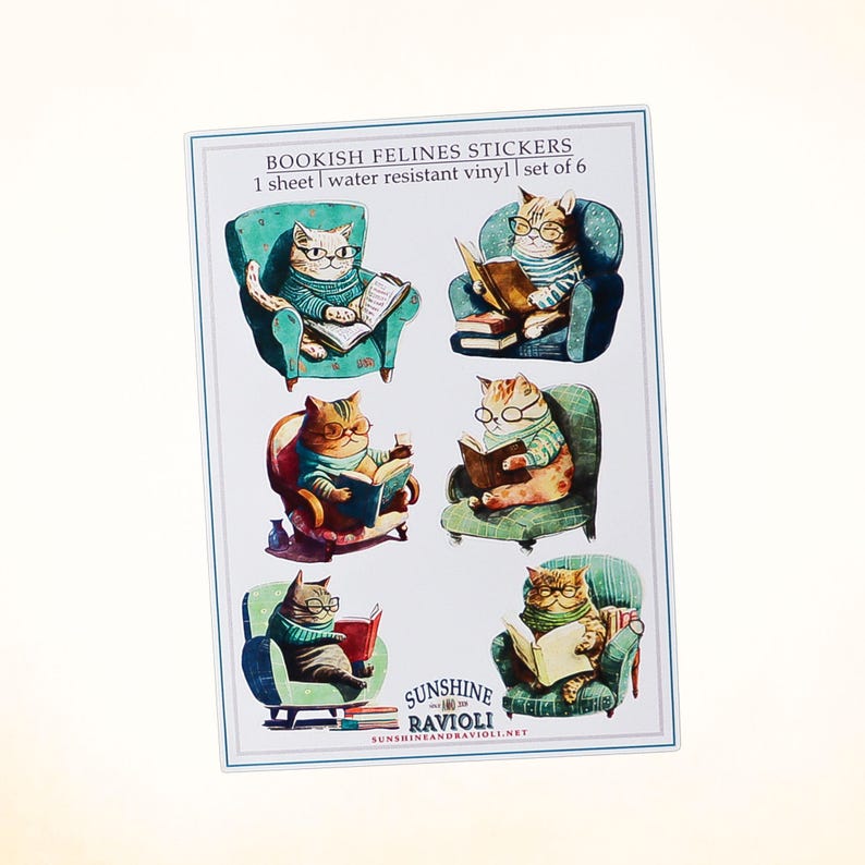 May include: A sheet of six water-resistant vinyl stickers featuring cats reading books in armchairs. The stickers are titled "Bookish Felines Stickers" and are from Sunshine and Ravioli.