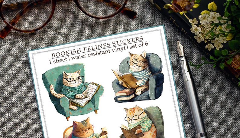 May include: A sheet of six water-resistant vinyl stickers featuring cats wearing glasses and reading books. The stickers are illustrated in a cartoon style with a whimsical and colorful design. "Bookish Felines Stickers" and "1 sheet | water resistant vinyl | set of 6" are printed on the sheet.