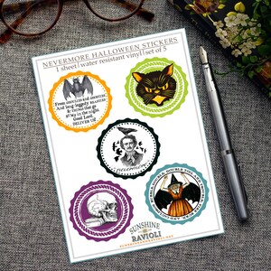May include: A sheet of five Halloween-themed stickers. The stickers feature various designs, including a black cat, a bat, a skull, a witch, and a portrait of Edgar Allan Poe. The stickers have a circular shape with decorative borders and text.