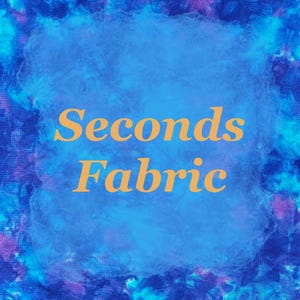 May include: An abstract image with a blue and purple background. A central blue shape contains the words "Seconds Fabric" in orange text. The background has a watercolor effect.